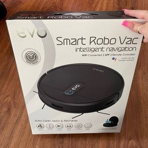 New vacuum in box has a remote to work it and charging deck